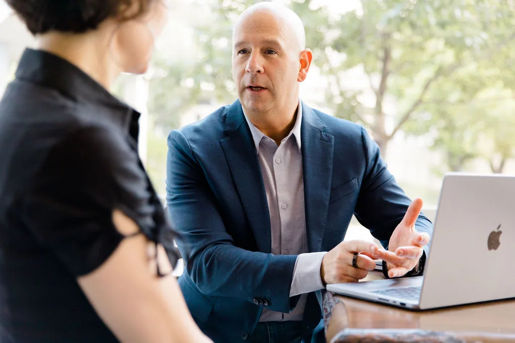 Dr. Steven Geanopulos consulting with a patient